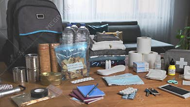 Emergency backpack equipment organized on the table