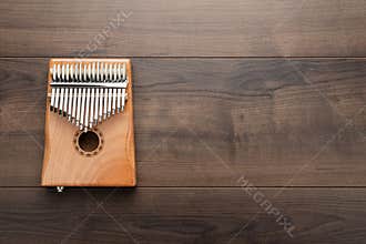 Kalimba on the wooden background