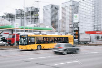 Ukraine, Kyiv - 15 January 2022: Yellow public transport bus car moving on the street. Editorial