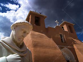 Chuch with statue in front