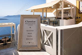 Street advertisement with local Greek dishes in Fira, Santorini