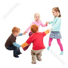 Children playing kids game holding hands in circle