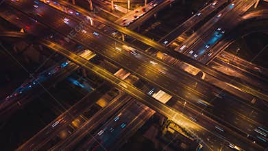Hyperlapse Time-lapse of car traffic transport on crossing lanes highway or expressway in Asia city at night, drone aerial view