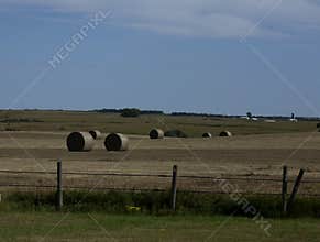Hay field in North Dakota with hay bales
