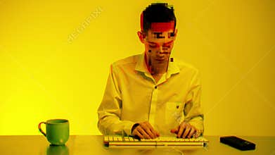 Busy businessman using keyboard and answering phone