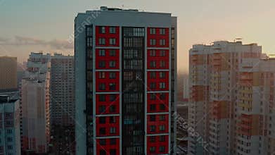 New modern residential complex in a residential area in the morning at dawn against the backdrop of the bright sun in
