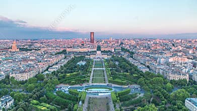 Aerial view of a large city skyline at sunset timelapse. Top view from the Eiffel tower. Paris, France.