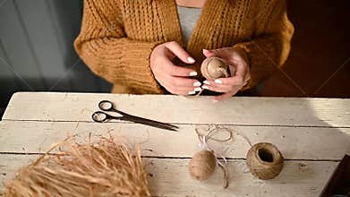 Woman creating decorative easter egg