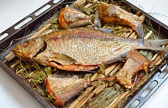 Long-cooked fish. Baked in a Russian oven on straw