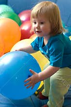 Girl playing with balloons