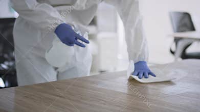 Video of spraying disinfection on surface in the office.