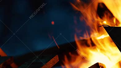 Fire and crackle of wood on a blurred background, peace and tranquility from the fire. Meditation under the colorful glow of burni
