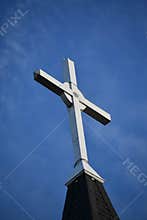 White Cross With Blue Sky Background