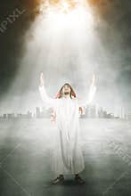 Arabian man praying to the Allah under bright light