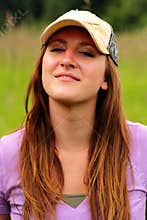 Pretty young lady wearing ball cap