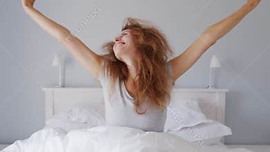 Beautiful woman wake up in morning feeling refresh and happy. Adequate sleep help keep you Good healthy. Clean bedroom