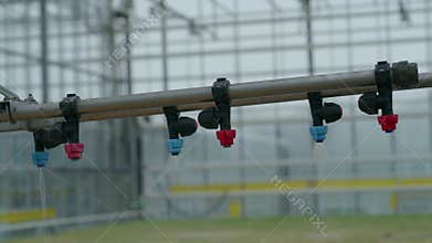 Close-up of an irrigation system in an eco greenhouse.