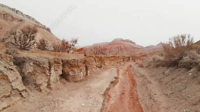 Drone shot of red canyon in desert mountains Aktau in Kazakhstan