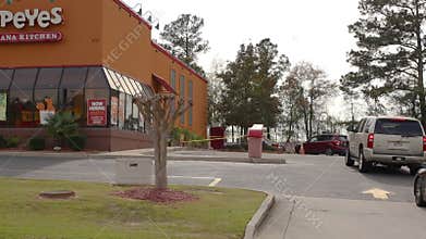Popeyes fried Chicken restaurant Backed up drive thru line on to the road on Belair Road