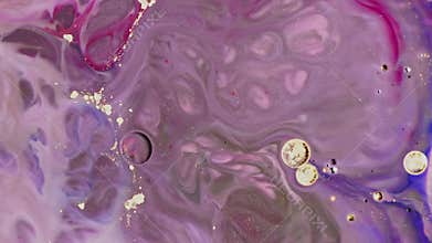 Close-up lilac oil paints are mixed together like beautiful artwork
