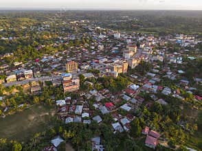 Aerial Drone shot of Chake Chake City, a Capital of Pemba island, Zanzibar archipelago. City in a river Delta at sunset