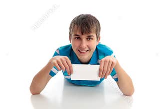 Boy lying down holding small sign award etc