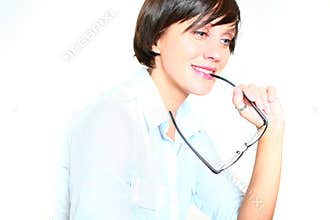 Girl smiling and biting glasses