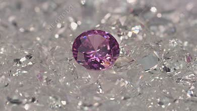 Amethyst diamonds are placed on a pile of white diamonds