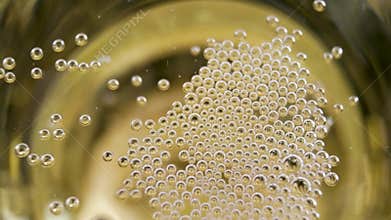 Gold bright champagne pouring and foaming in glasses