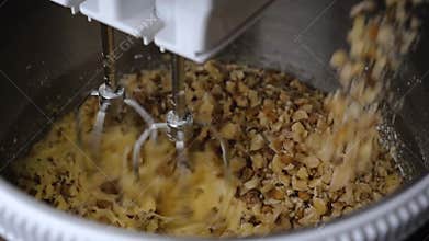 Homemade peanut pie dough using an electric mixer.
