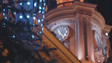 City Hall building glows beautifully in evening. Stock footage. Street lamp with garland on background of historic