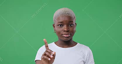 Woman saying no by waving her finger