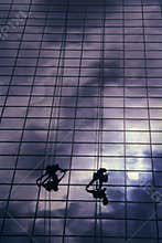 Workers cleaning windows