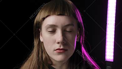 Footage of young woman with short bangs