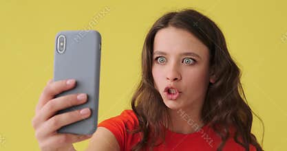 Woman video chatting using mobile phone