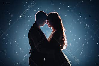Gorgeous newlywed couple in the light.