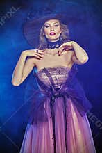 Charming witch in evening dress