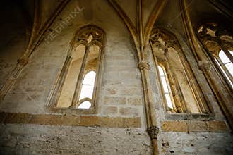 Interior of Chapel of St. Archangel Michael in medieval castle Bezdez, gothic arched windows in church, rib vault, altar part,