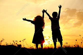 Silhouette, happy children playing