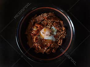 Beef bulgogi with kimchi and egg on rice