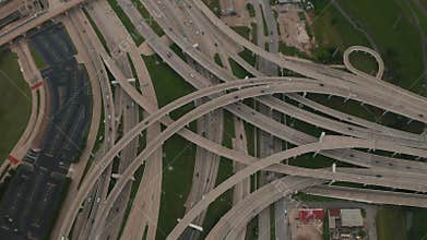 Aerial birds eye overhead top down view of large and complex multilane highway intersection. Multilevel transport
