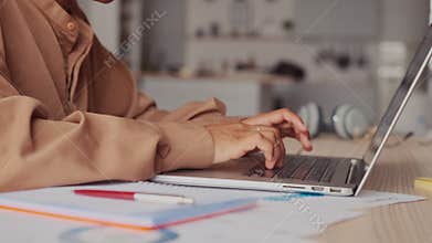 Woman working on computer using touchpad typing corporate message communicating