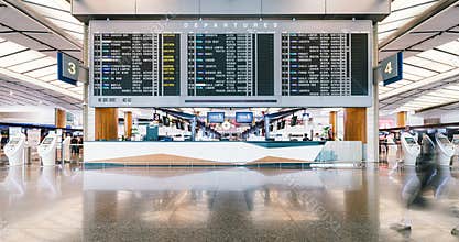 Time-lapse of people walking at arrival departure board in Changi Airport terminal