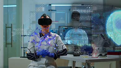 Scientist in lab wearing VR goggles working on augmented reality holograms