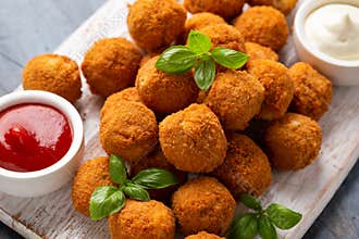 Meat free vegetarian mini picnic scotch eggs with micoprotein and herbs served with ketchup and mayonnaise