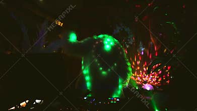 Dj guy dancing. Nightclub entertainment performance with led heart light on back