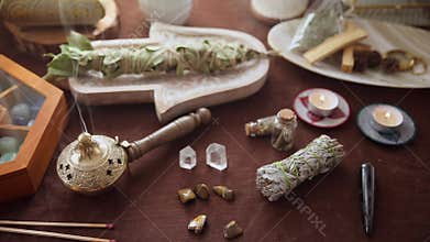 Close-up of a medicinal herb burner with smoke coming out