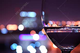 Wine glass with blurred lights