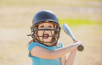 Portrait of excited amazed kid baseball player wearing helmet and hold baseball bat. Funny kids sports face.