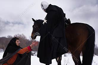 Knight gives the peasant a coin